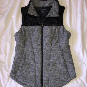 grey and black north face vest